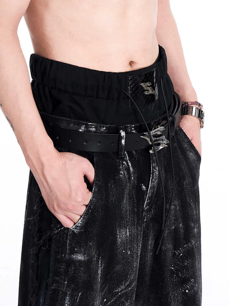 Black men's double-layer cowhide leather belt with a metal letter buckle, laid flat.