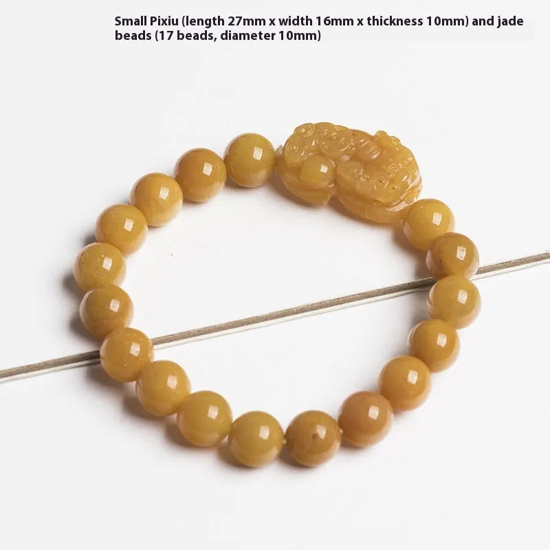 Golden thread jade bracelet with carved money motif showing detailed surface texture and jade beads