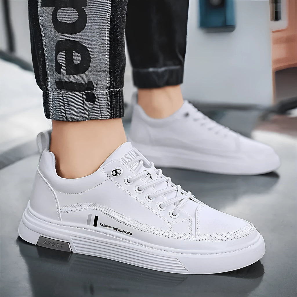 Men's low-top white skate shoes with elastic band fastening and a round toe, shown on a plain background.