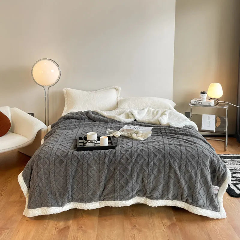 Polyester thermal flannel blanket in tea green colour on a double bed, showing 180x200cm size.