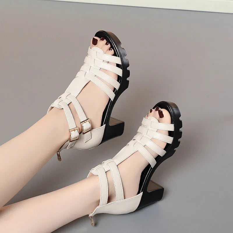 Women's beige high heel shoes with hollow-out design and rhinestone decoration on the upper.