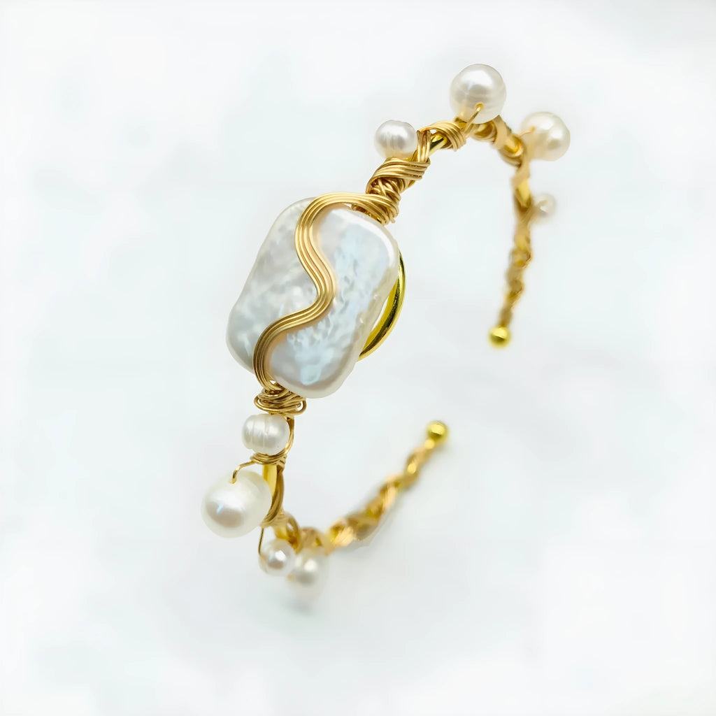 Natural freshwater pearl handmade wire-wrapped bracelet in gold titanium steel on wrist