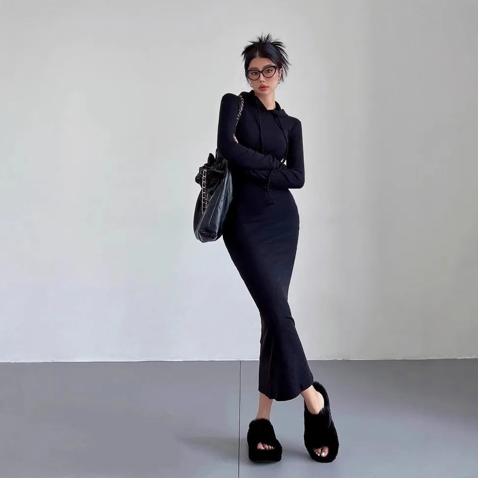 Women's grey hooded long sleeve sheath dress with a high waist on a model.