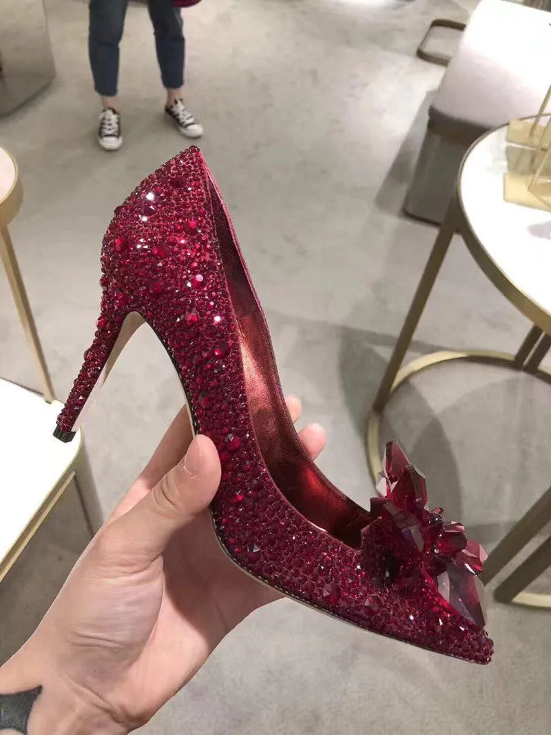 Women's gold stiletto heels with rhinestone decoration and pointed toe