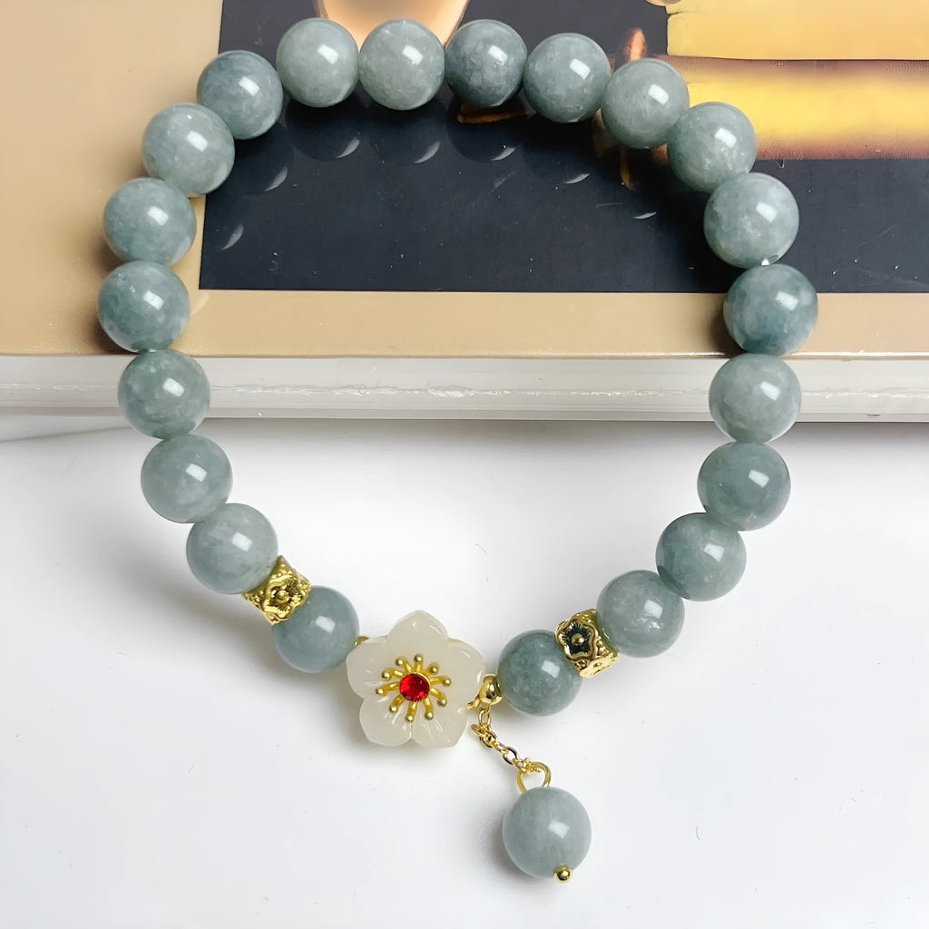 Women's retro style jade bracelet with adjustable rope closure on wrist