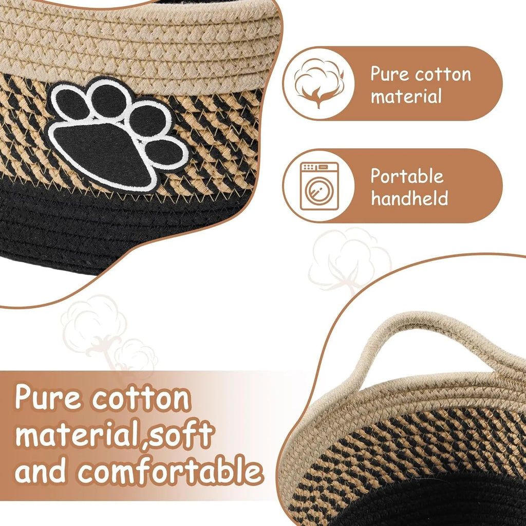 Small light beige woven cotton rope storage basket with a wooden handle.