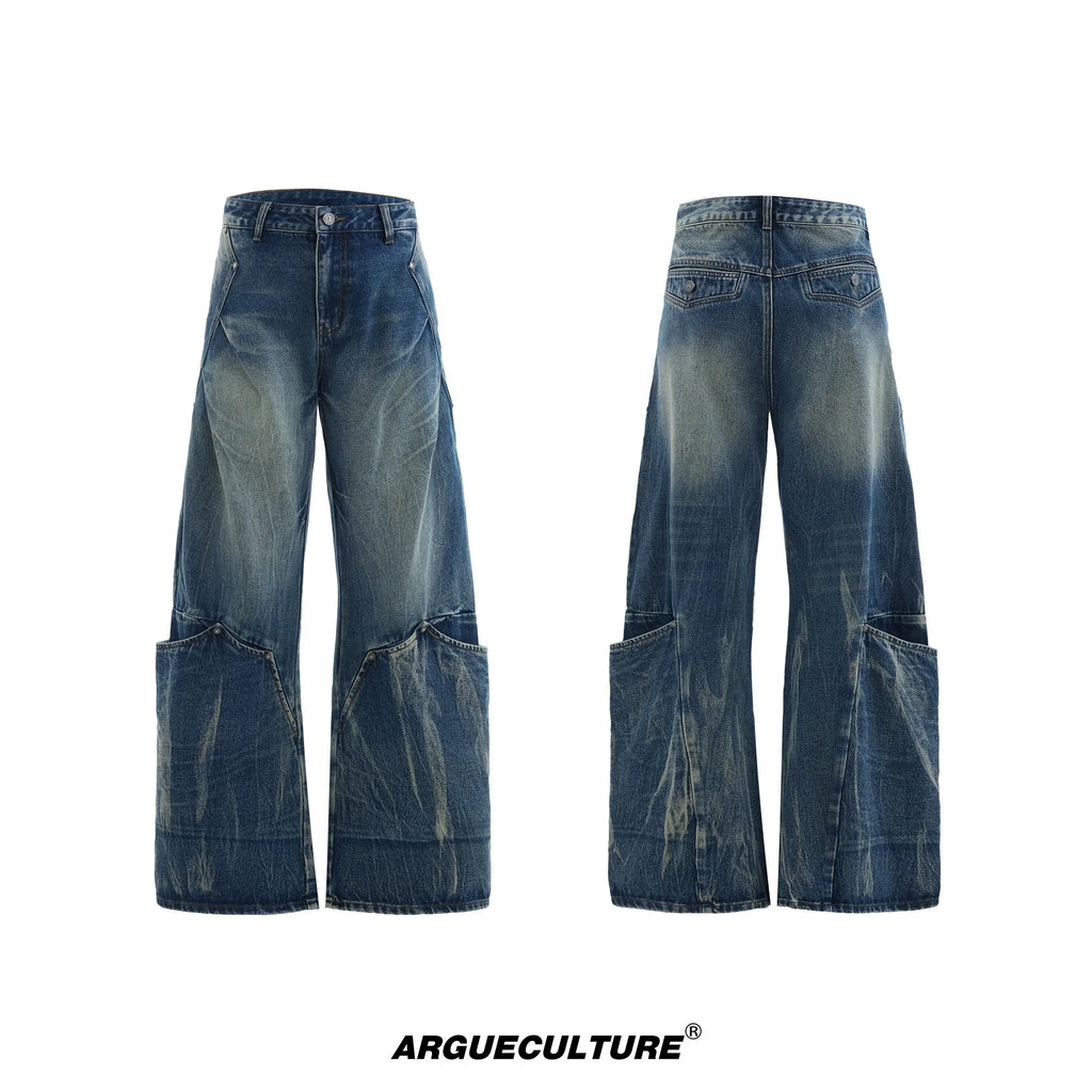 Men's verdant blue jeans with a retro washed burst pattern and curved knife details, shown in a loose fit.