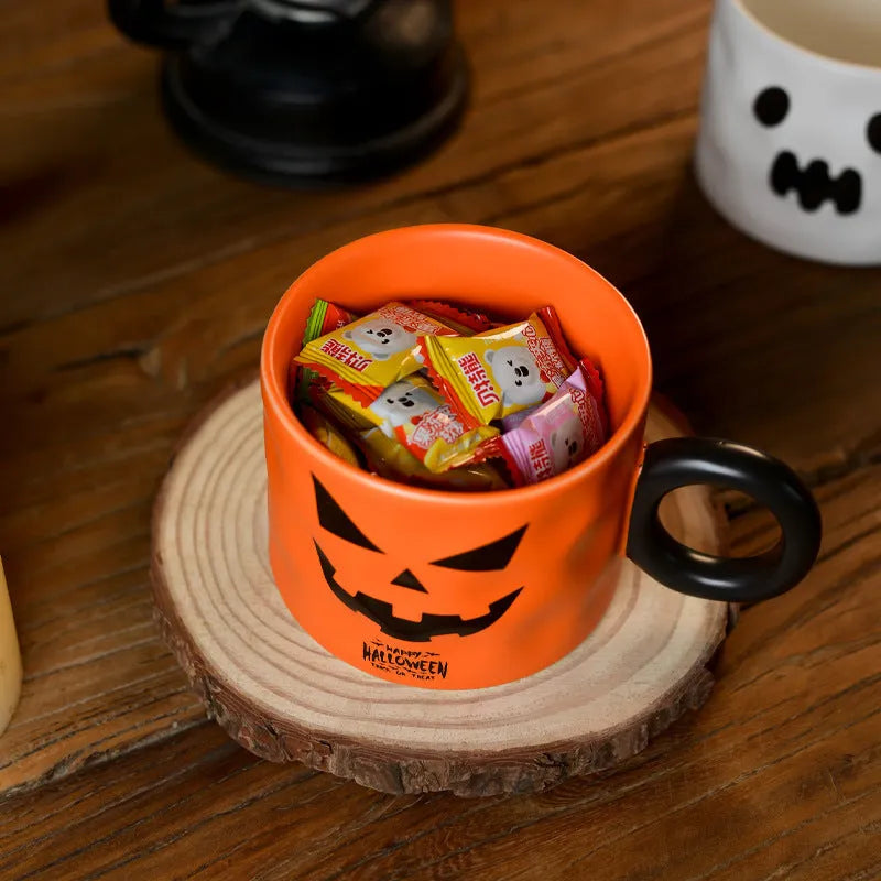 Orange ceramic Halloween pumpkin mug with handle and dessert spoon in gift box packaging