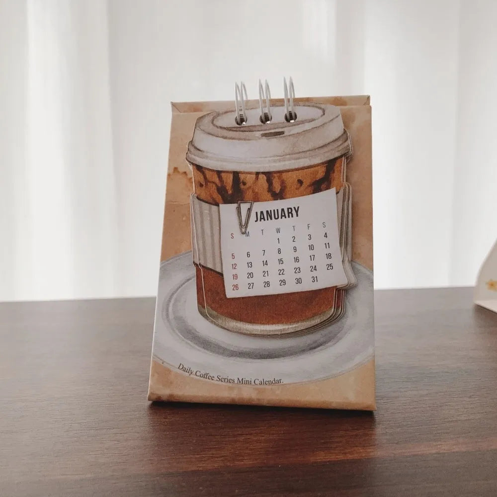 Coffee Coffee mini desk calendar set showing four 2025 paper calendars with different themes for daily inspiration