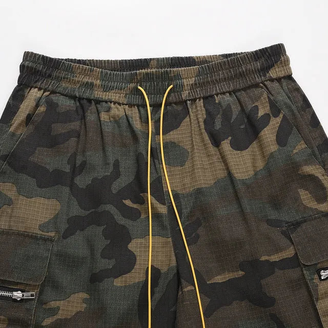 Men's green multi-bag washed camouflage cotton shorts with a loose fit on a mid-waist.