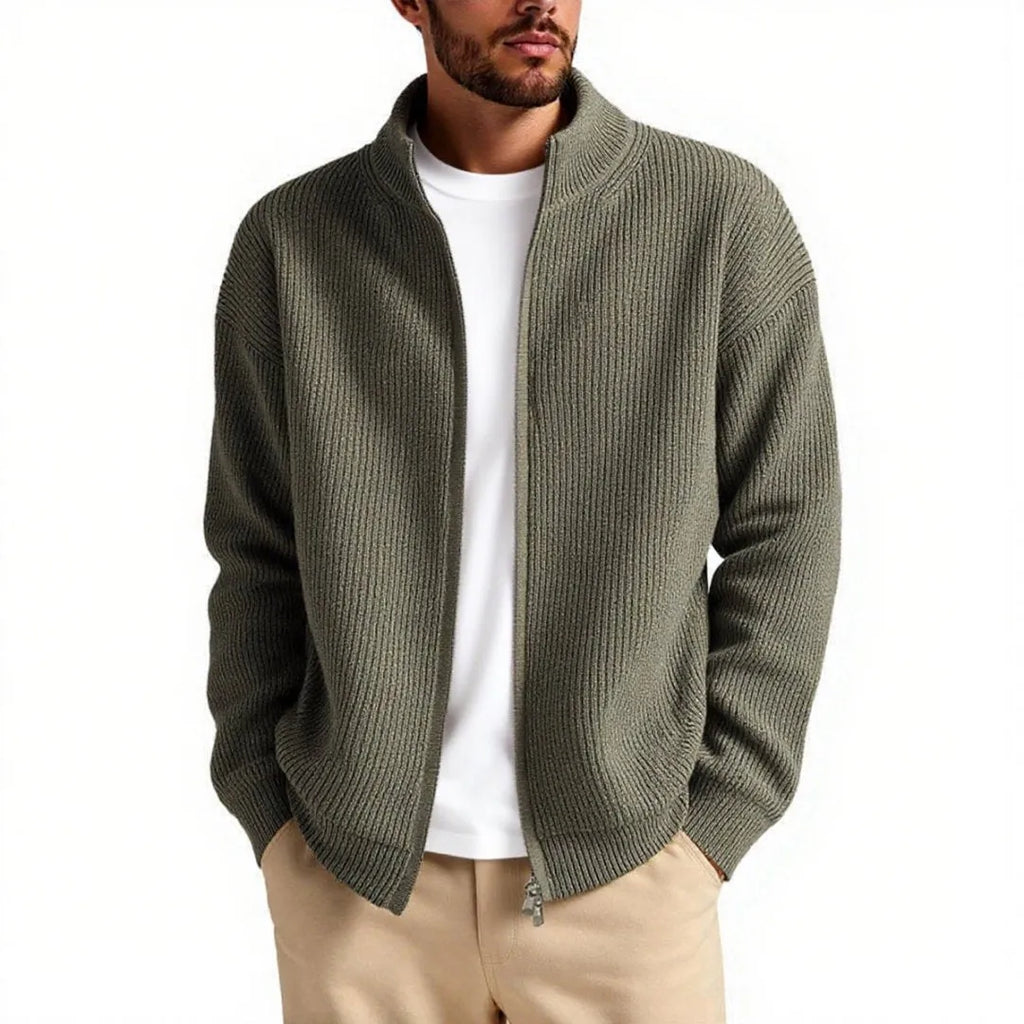 Man wearing a loose-fit grey cardigan sweater coat, showing the relaxed silhouette and knit texture.