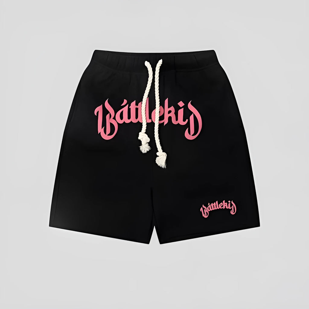 Man wearing loose-fit black cotton-blend cropped shorts in a streetwear style.