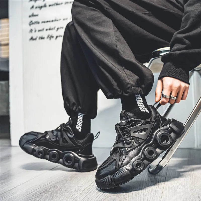 Men's low-top casual sneakers with mesh upper and thick rubber sole in black, grey, or white.