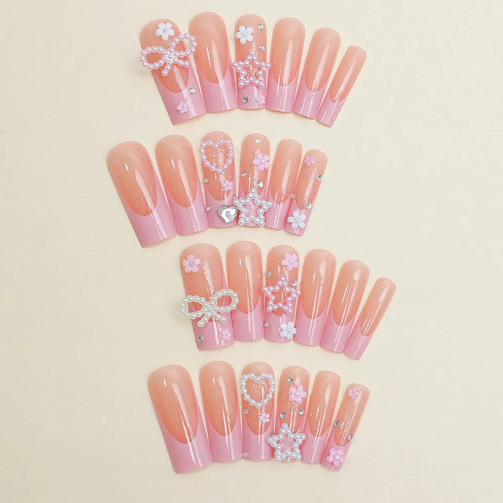 Decorative false nails with extended water pipe French tips, bow detailing and diamond accents in colour XB-70-48