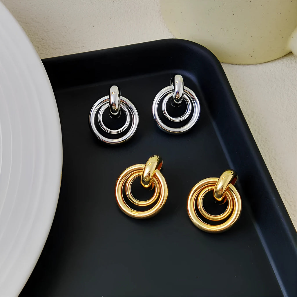 Geometric round ring earrings with irregular design in gold and silver electroplated finishes