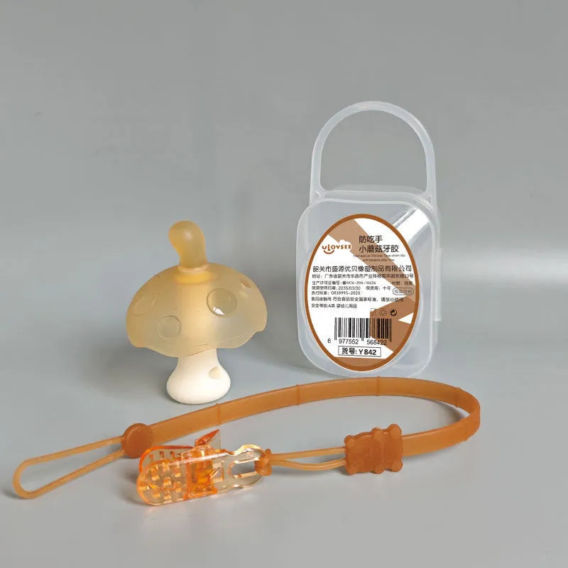 Small pink mushroom-shaped chew toy with a nano chain on a white background, inside a transparent box.