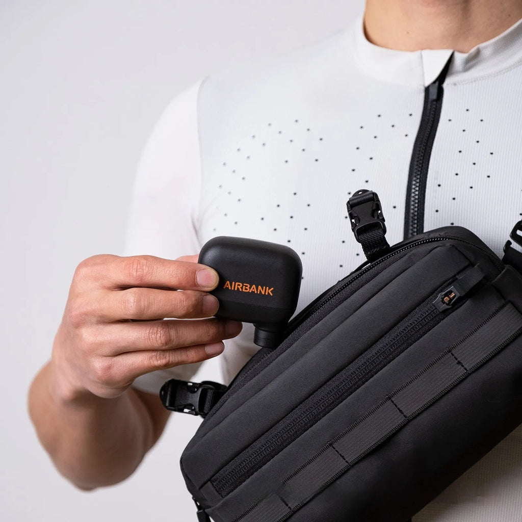 Black AS100 electric bicycle inflator pump with USB cable and waterproof storage bag