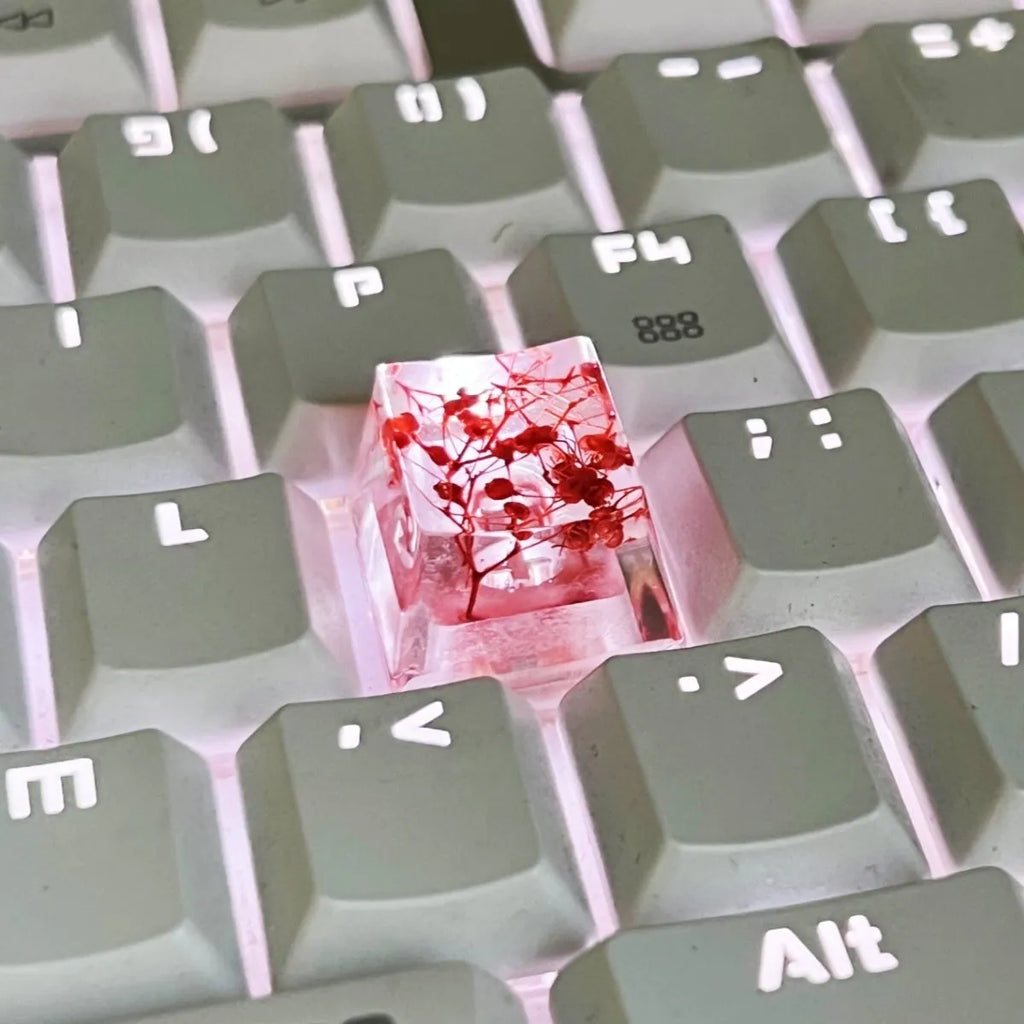 Transparent resin keycap with starry sky design in red, pink, green, or violet colours