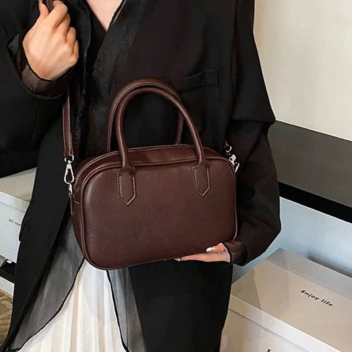Retro square shoulder messenger bag in black PU leather with a single strap.