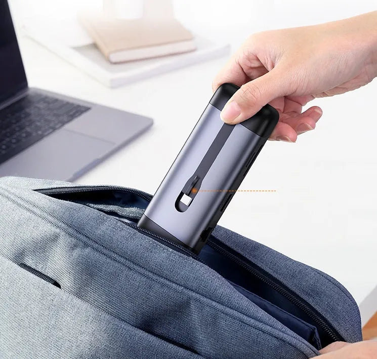 USB-C docking station hub showing HDMI port, USB 3.0 ports, and compact 0.09m design