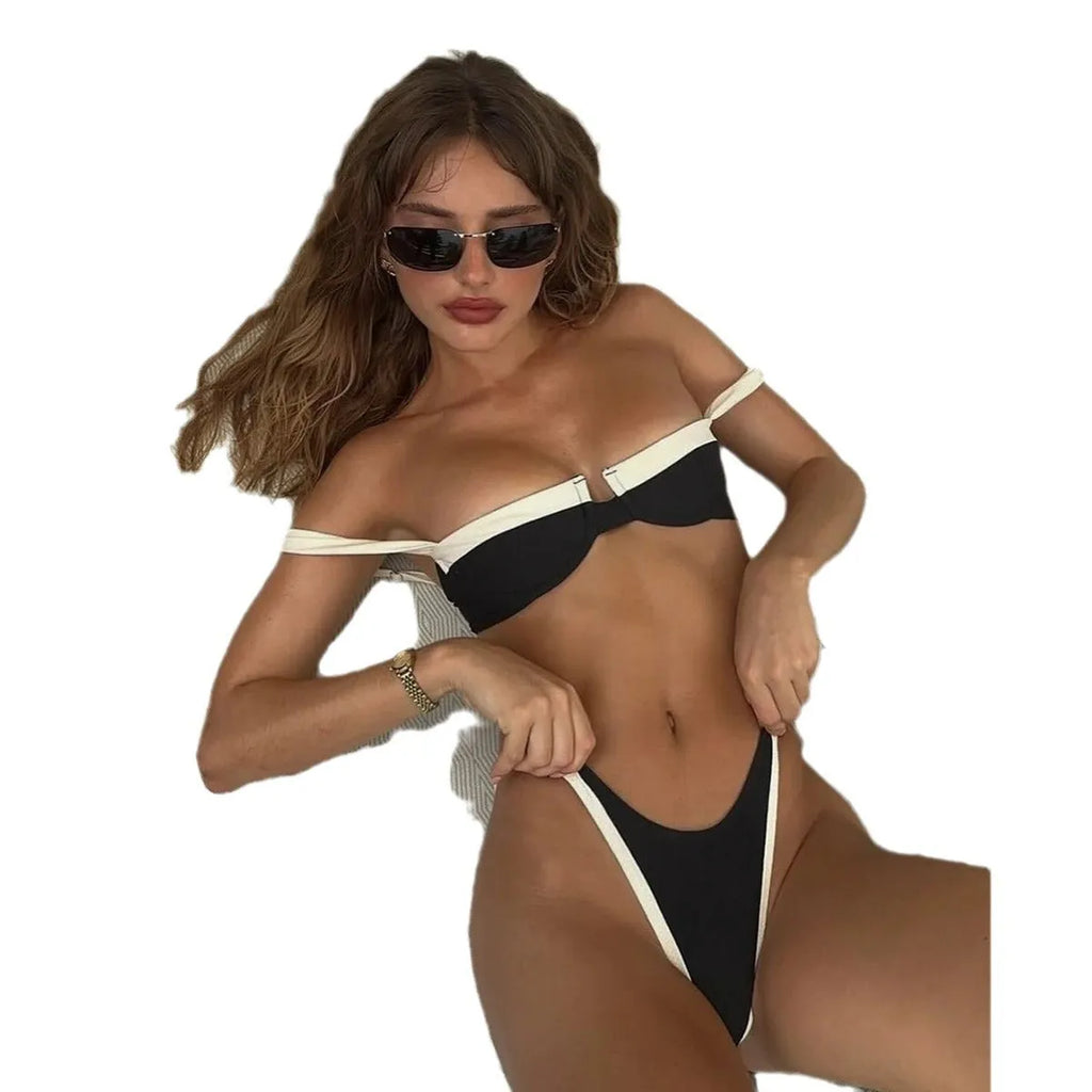 Black women's bikini briefs with stitching detail, nylon fabric, sizes S M L.