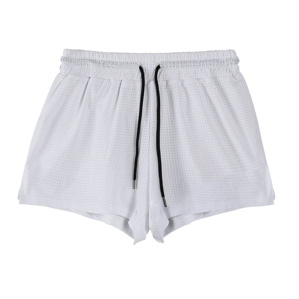 Men's black quick-drying nylon sports shorts on a summer background