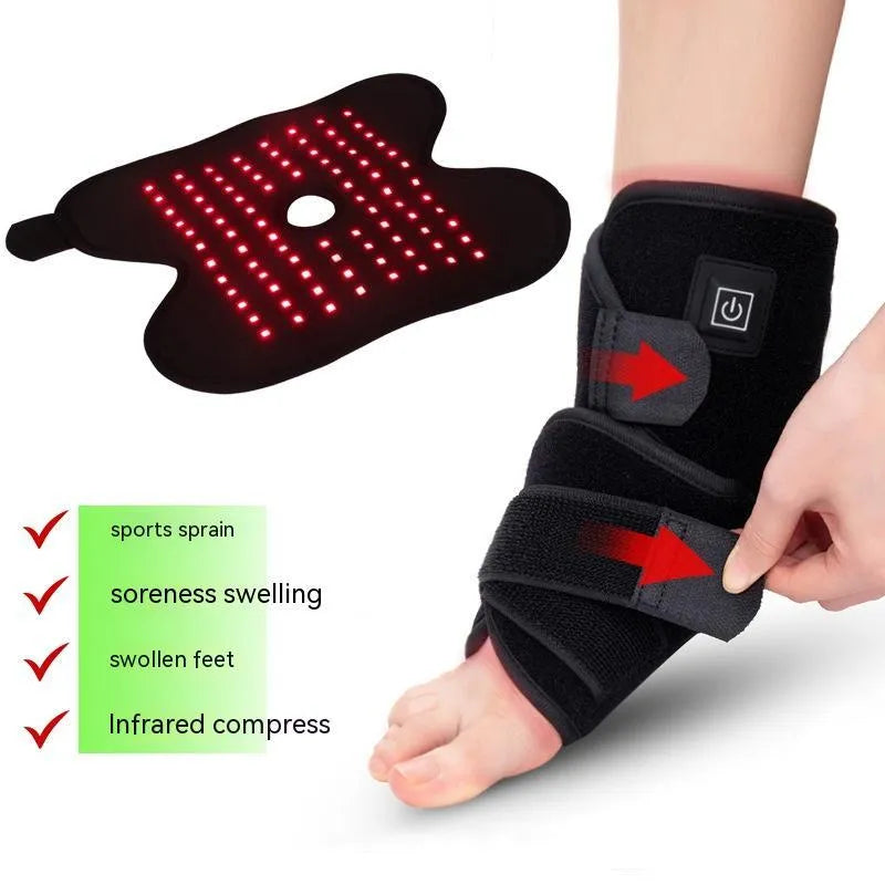 Black fabric ankle support with red light and heating therapy, USB cable, on a flat surface