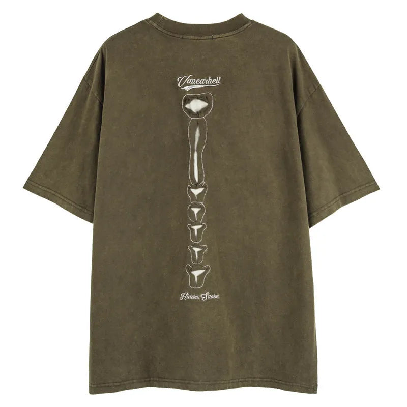 Brown loose-fit men's t-shirt with a skull and letter graphic print and drop-shoulder sleeves.