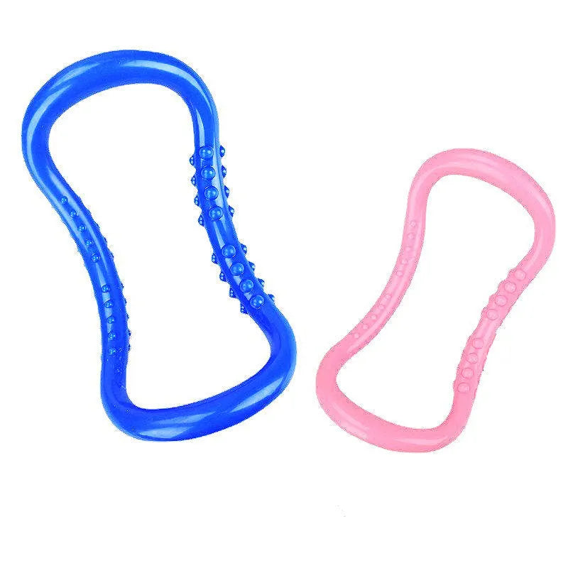 A purple, blue, or pink PP plastic yoga ring used for stretching and back opening exercises.