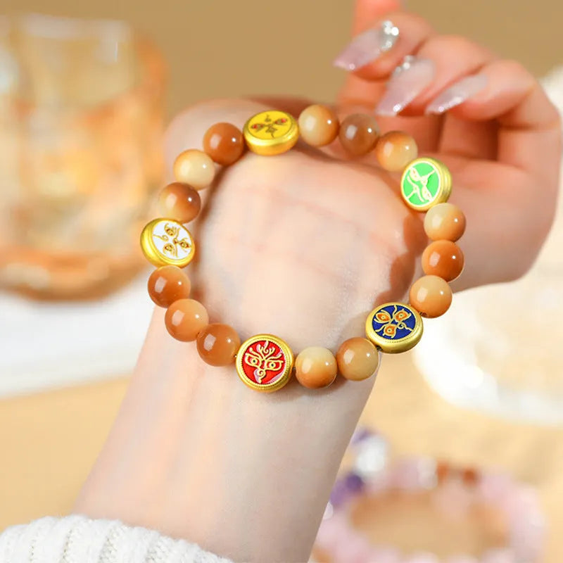 Yellow bodhi seed bracelet with five directions pattern and round geometric design