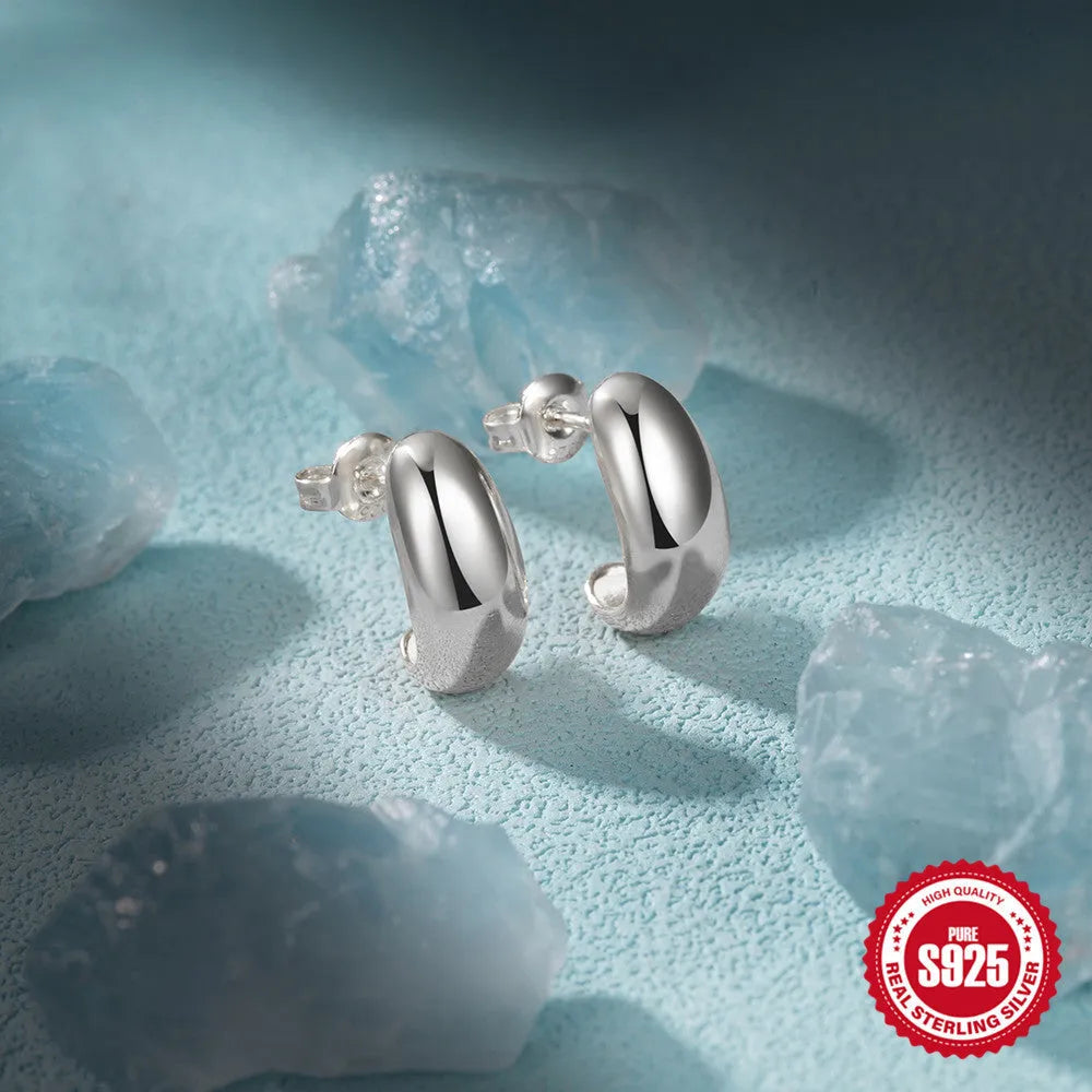 C-shaped sterling silver stud earrings with electroplated gold or silver glossy finishes