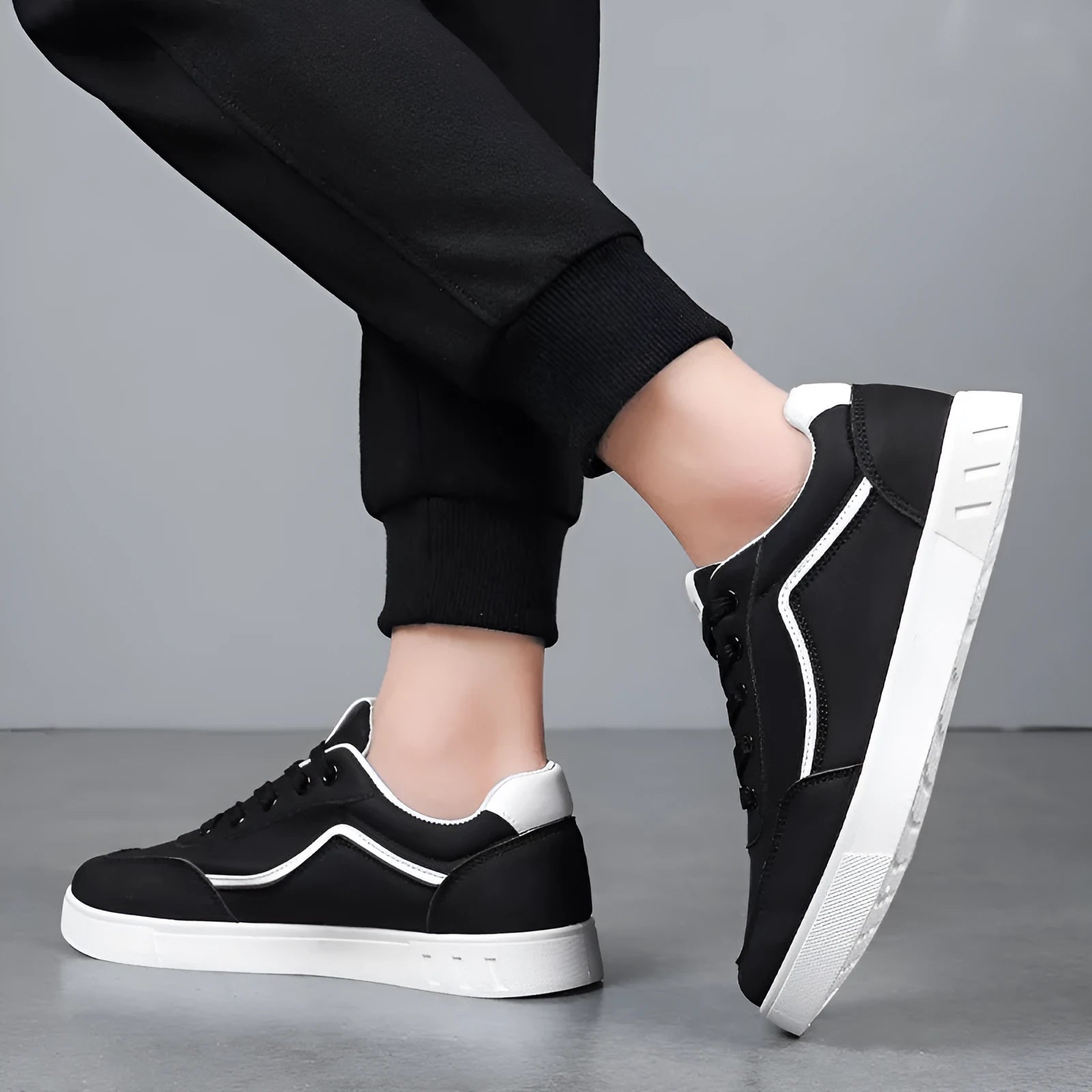 Korean trendy board shoes in black and white colours with mesh lining and rubber soles
