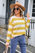 Women's loose blue acrylic sweater with striped pattern and round neck.