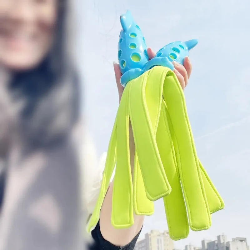 Blue cuttlefish-shaped squeaky dog chew toy, approximately 39cm long, made from rubber and cloth.