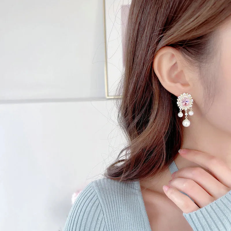 Oval geometric copper earrings with inlaid zircon accents and pearl tassel drops in light purple colour