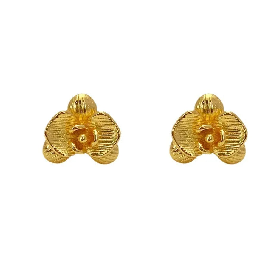 Retro style flower earrings for women in gold or silver finish with petal detailing