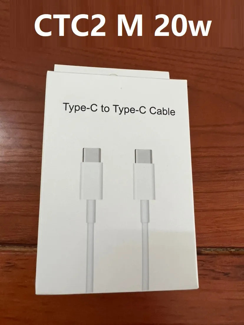 White 20W USB-C PD fast charger with UK plug and a coiled charging cable.