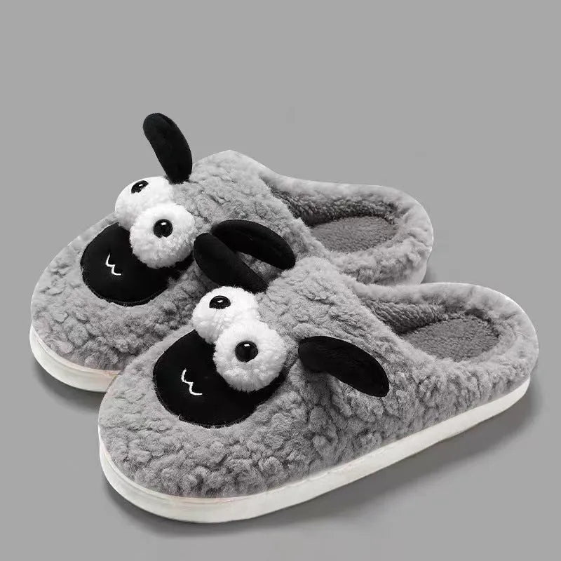 Brown lamb thermal cotton slip-on slippers with suede upper and PVC sole on a wooden floor.