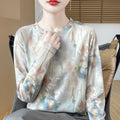 Women's round neck knitted pullover in a Tencel cotton blend with a printed floral design on the front.