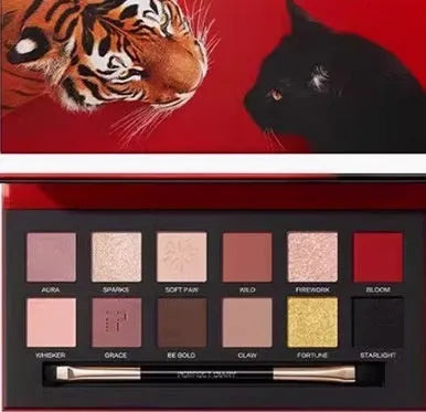 Twelve-colour animal eye shadow palette with themed designs including cat, tiger, fox and leopard patterns