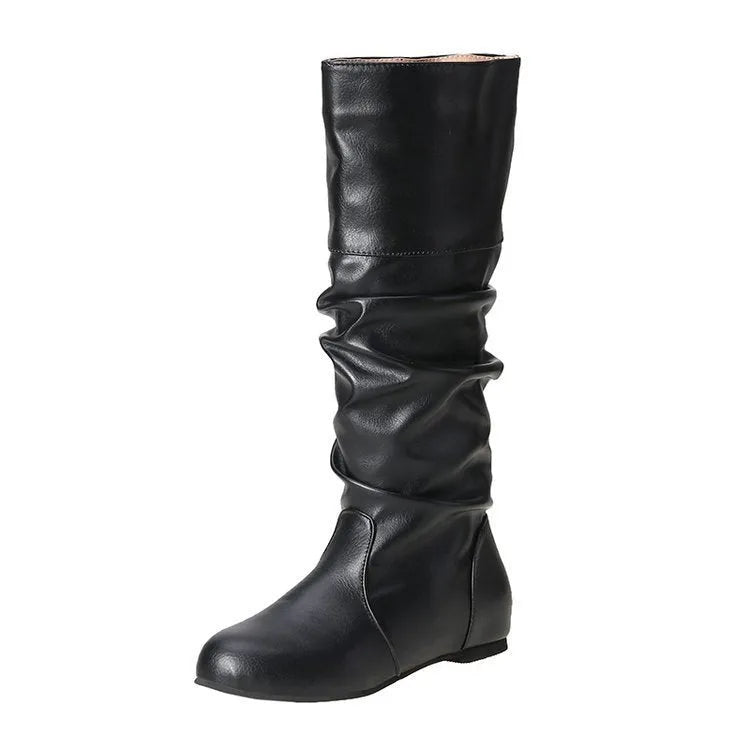 Women's black slip-on flat boots with round toe and high cylinder shaft on neutral background