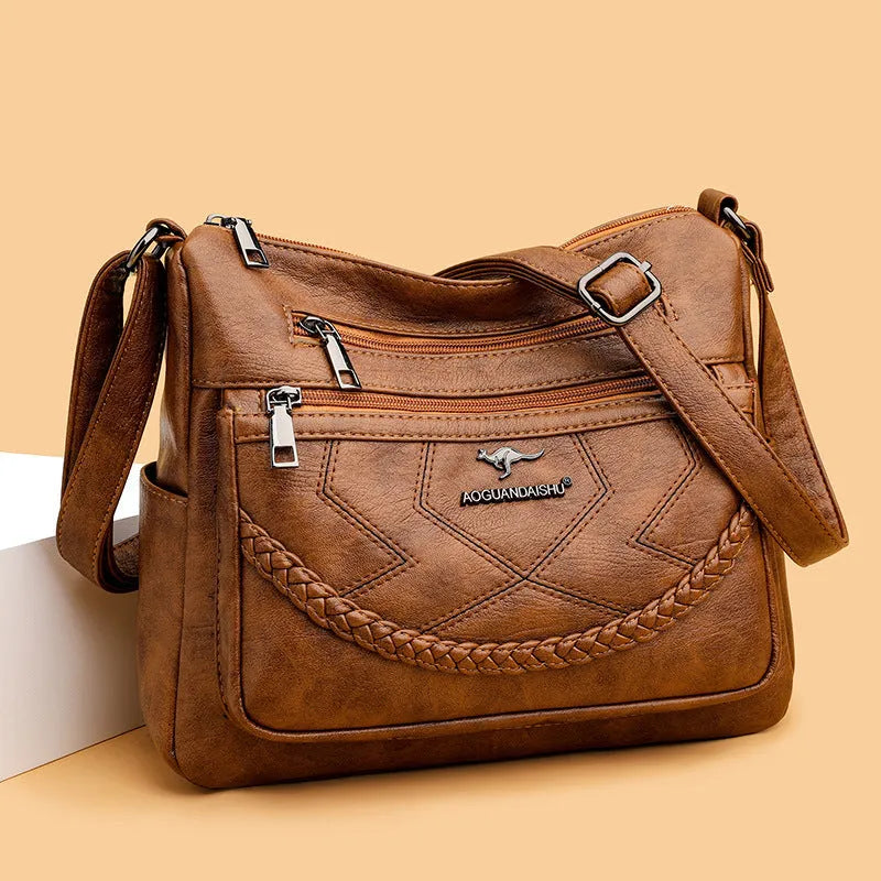 Soft leather women's shoulder bag in horizontal square design with crossbody strap