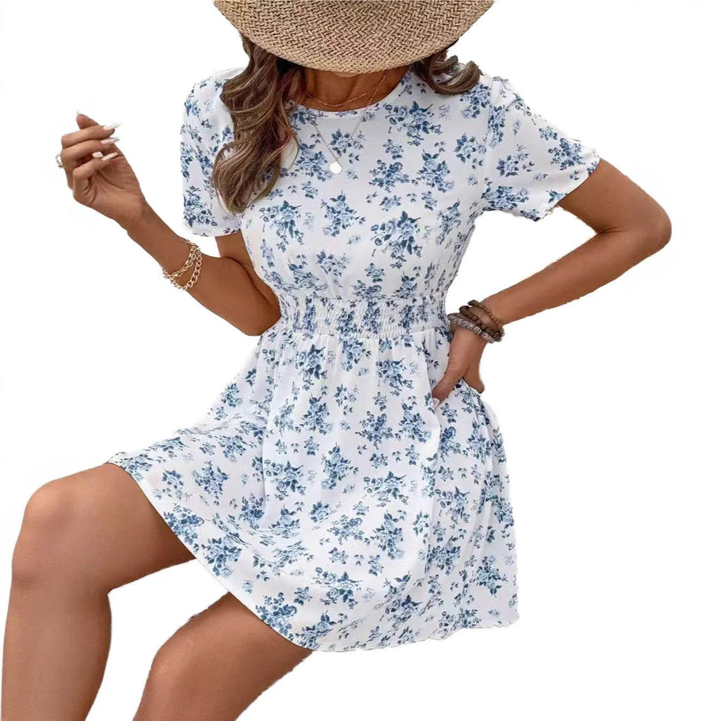 Light blue backless A-line casual dress with high waist and midi length on a model.