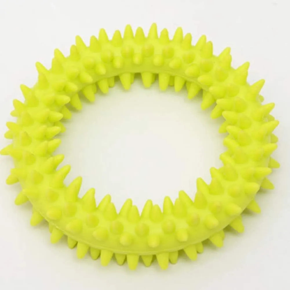 Blue TPR spiked ring dog chew toy for dental cleaning and bite training on a white background.