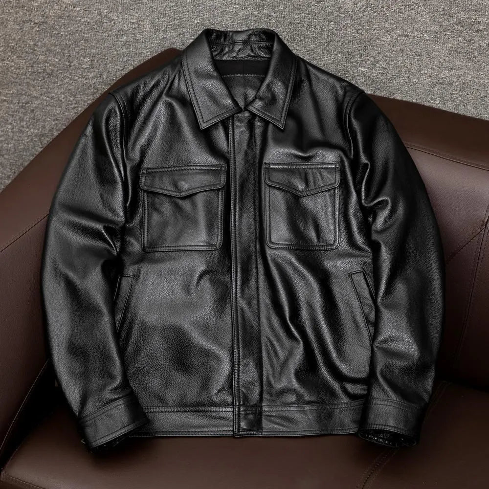 Men's black retro-style leather jacket with side pockets showing loose fit design