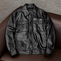Men's black retro-style leather jacket with side pockets showing loose fit design