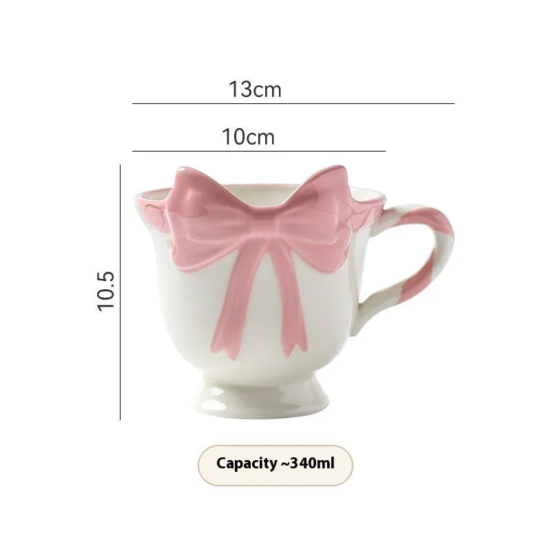 Ceramic mug with heart bow design in black pink colour, 301-400 ml capacity