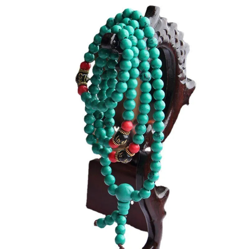 Turquoise Tibetan bracelet with 108 polished round beads on single strand