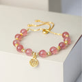 Women's strawberry quartz crystal bracelet with geometric design and fu character element