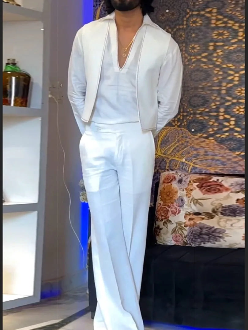 White three-piece outfit showing V-neck shirt, sleeveless vest, and full-length trousers laid flat